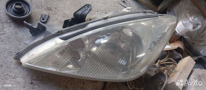 Фара левая lancer 9