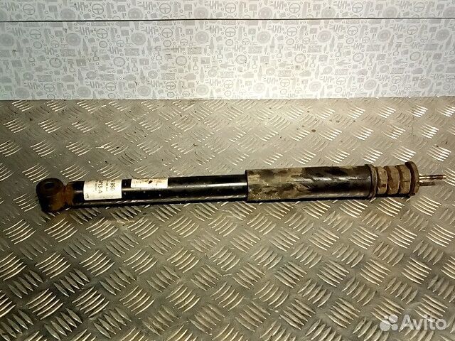 Амортизатор задний левый Nissan Note E11 2007