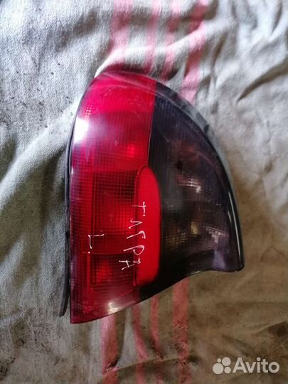 Задний левый фонарь опель тигра