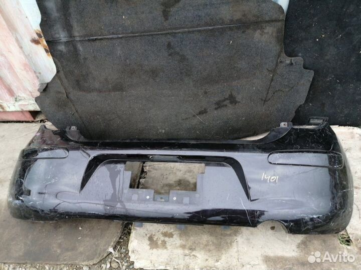 Бампер задний Nissan March K13