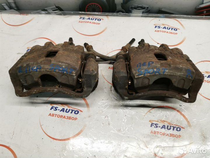 Суппорт тормозной передний Kia Sportage 2 2.0 G4GC