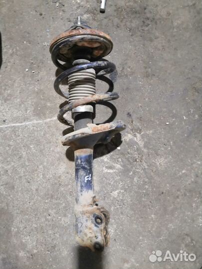 Амортизатор перед.левый Mitsubishi Outlander XL