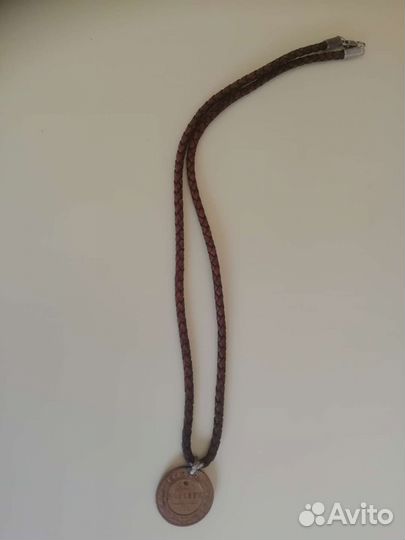 Монета медная 1912 года на кож. шнурке