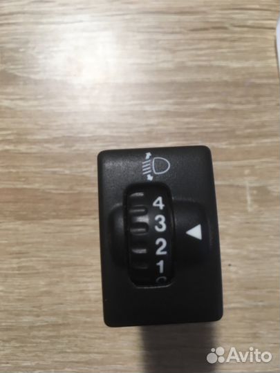 Сузуки лиана кнопка корректора фар