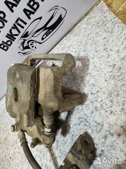 Суппорт передний левый Tociko