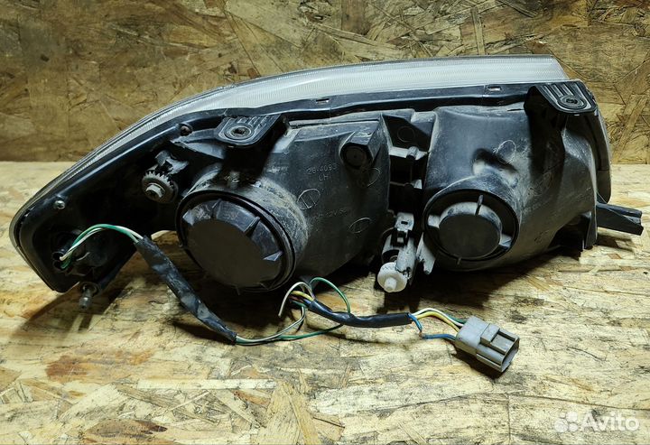 Фара левая Nissan Almera Classic с мех.корректором