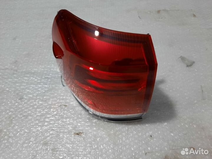 Фонарь наружный задний левый Тoyota Land Cruiser