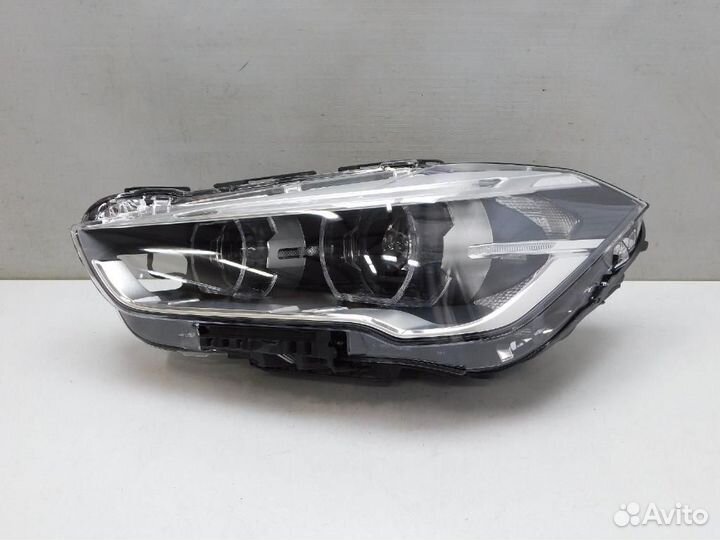 Фара левая BMW X1