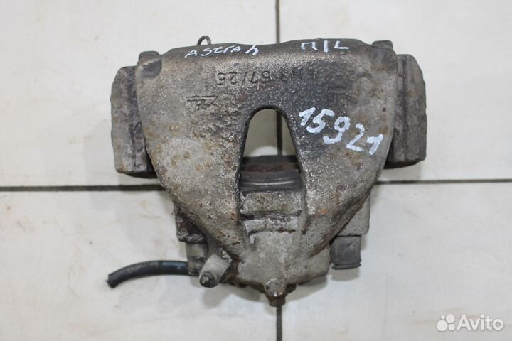 Суппорт тормозной передний левый Opel Astra H