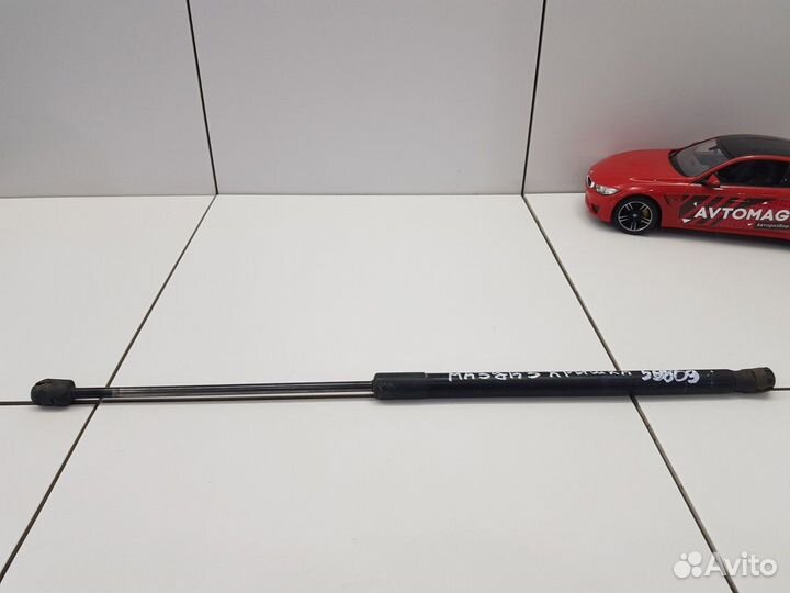 Амортизатор багажника левый (Mazda 3)