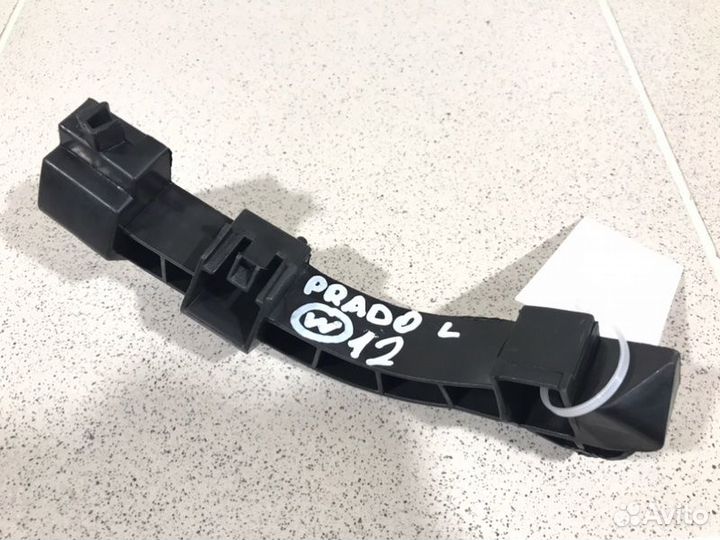 Кронштейн переднего бампера левый Toyota Land