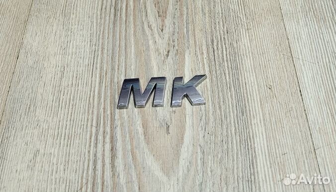 Надпись монограмма буква Geely MK