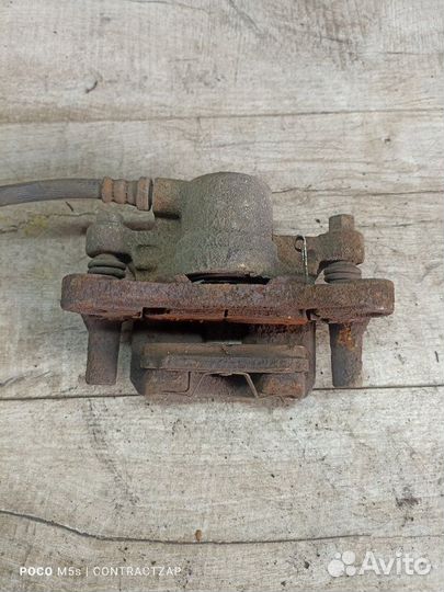 Суппорт тормозной задний правый Mitsubishi Lancer