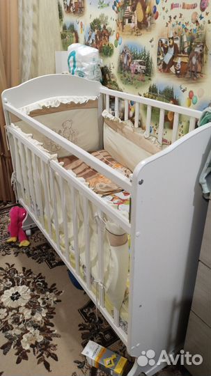 Детская кроватка с продольным маятником