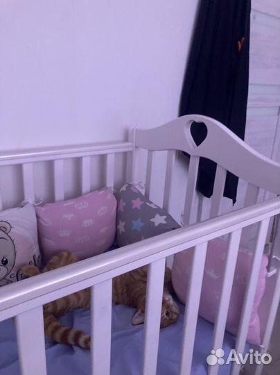 Детская кроватка с продольным маятником