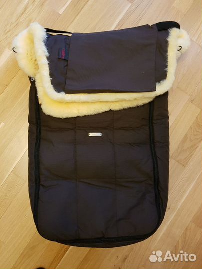 Меховой конверт в коляску фирмы Christ