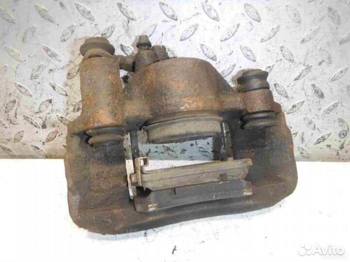 Суппорт тормозной передний левый Mazda Demio