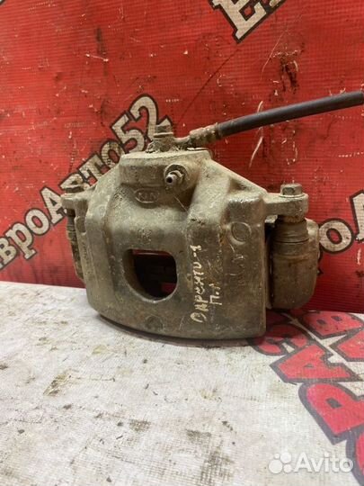 Суппорт тормозной передний левый Kia Sorento 1 EX