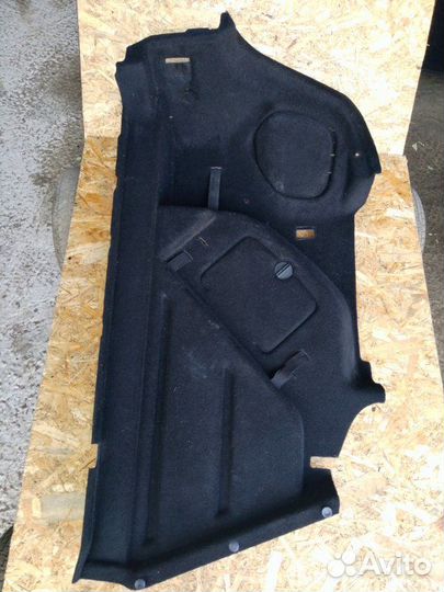 Обшивка багажника левая Opel Astra J седан 1.6
