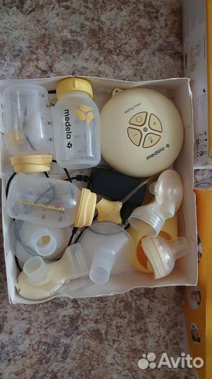 Молокоотсос medela swing maxi