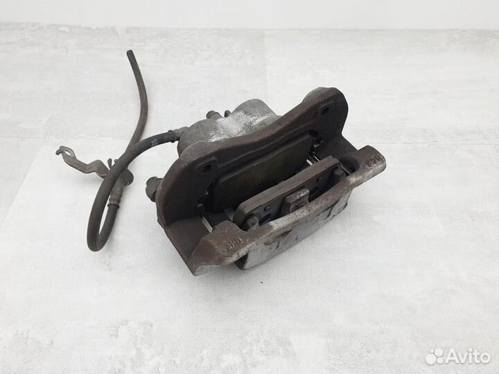 Суппорт тормозной передний левый Hyundai Santa Fe