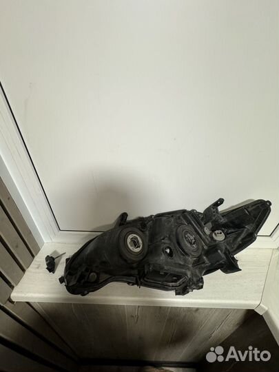 Фара левая для toyota corolla 150