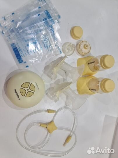 Молокоотсос medela электрический