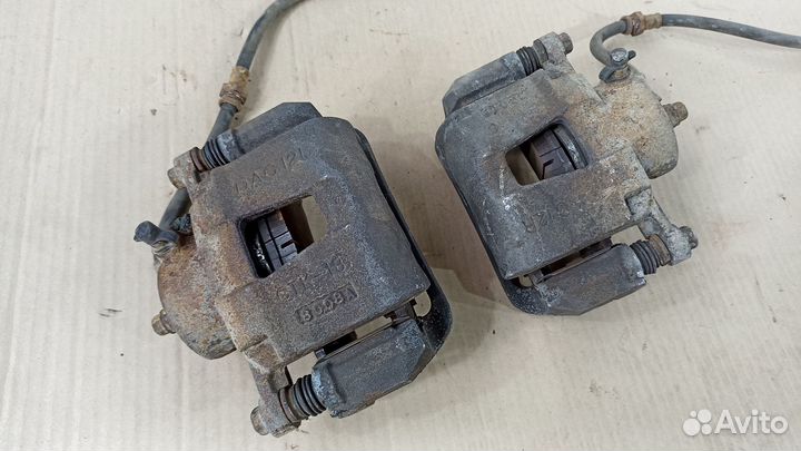 Суппорт тормозной левый правый Шевроле Лачетти