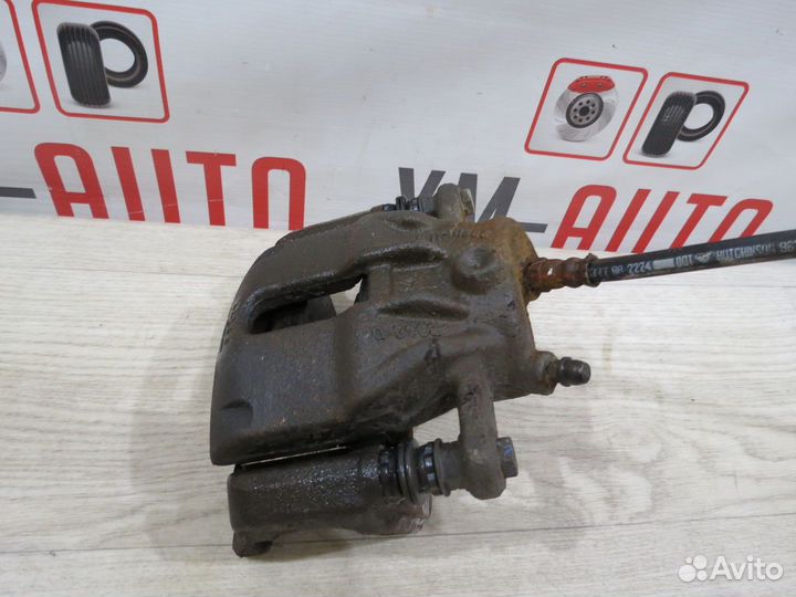 Суппорт тормозной передний левый Nissan Almera G15