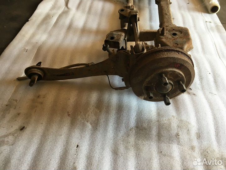 Рычаг задний продольный левый со ступицей