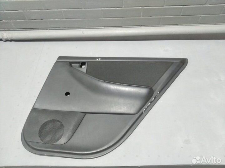 Обшивка боковой двери задняя правая Toyota Corolla