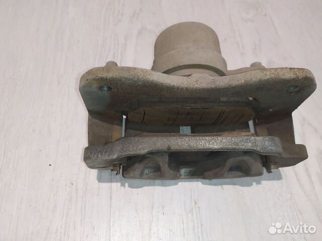 Суппорт тормозной перед Geely emgrand X7 Лев