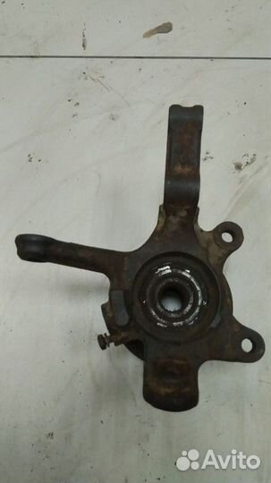 Кулак поворотный левый Nissan Almera