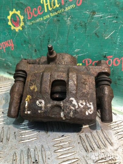 Суппорт задний левый Mitsubishi Lancer 9 седан