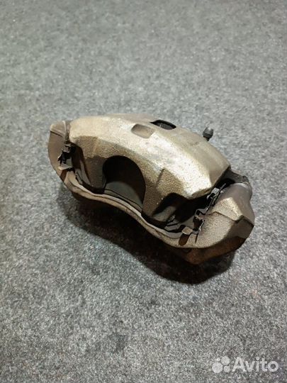 Суппорт тормозной передний левый Mitsubishi Lancer