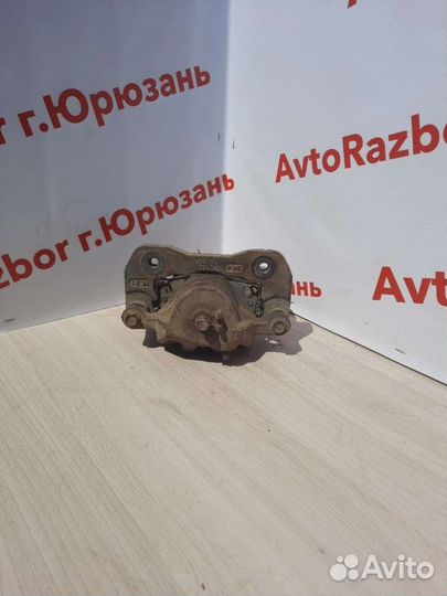 Суппорт передний левый Kia Carens 02-06г.в