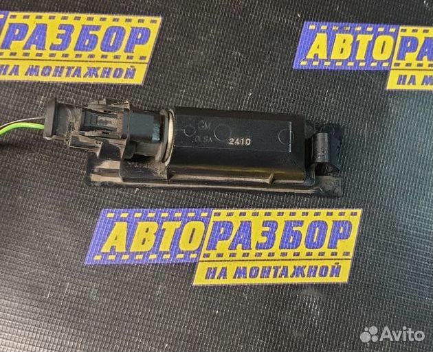Фонарь подсветки номера Opel Astra