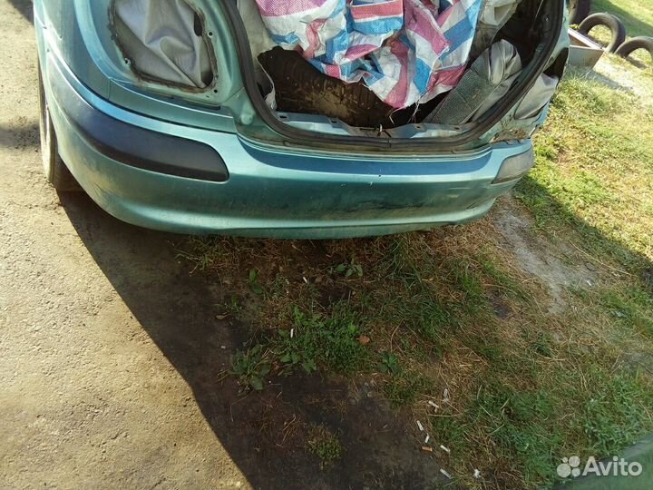 Ниссан Алмера Н16 хетчбек задний бампер цвет BW3K