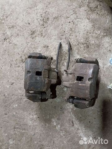 Суппорт тормозной передний Mitsubishi Lancer 9