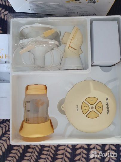 Молокоотсос medela электрический