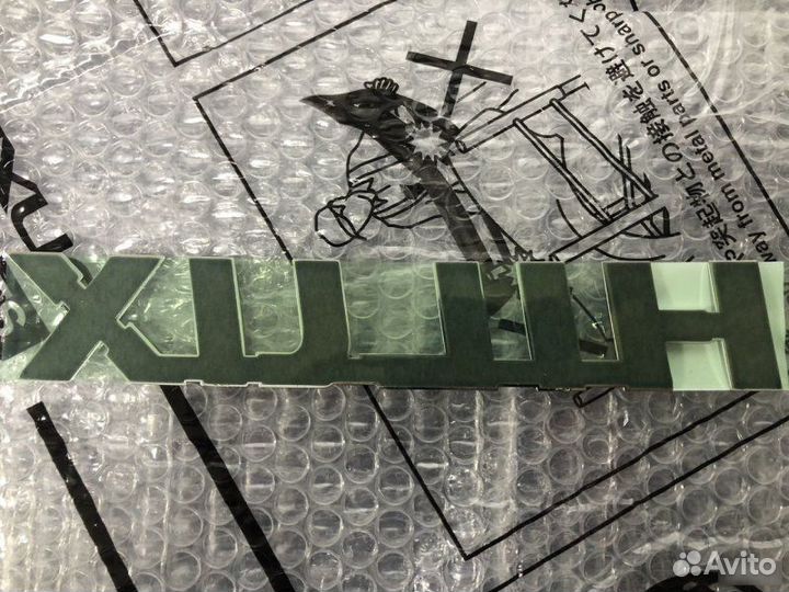 Эмблема багажника Toyota Hilux