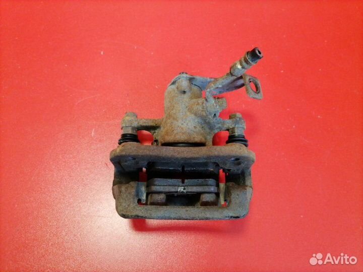 Суппорт задний левый Hyundai Solaris RB G4FC 2012