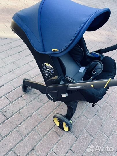 Коляска автокресло doona с базой isofix