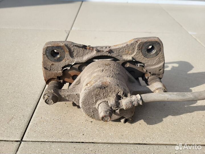 Тормозной суппорт передний левый Chevrolet Лачетти