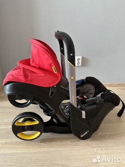 Автолюлька на колесах doona с базой