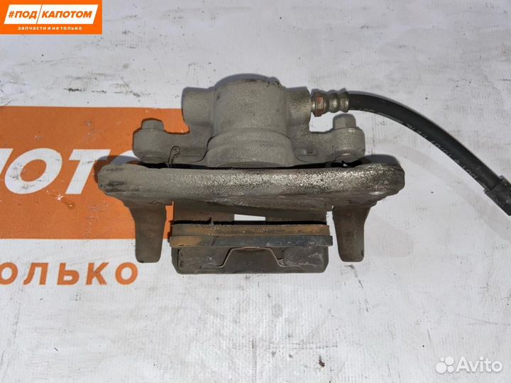 Суппорт тормозной задний левый Mitsubishi Lancer