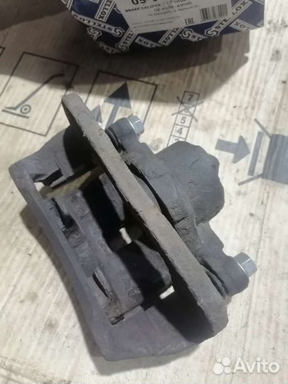 Суппорт передний KIA Spektra левый