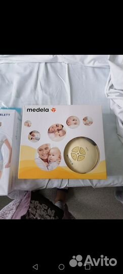 Молокоотсос medela электрический