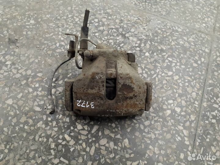 Суппорт тормозной передний левый Volkswagen Passat