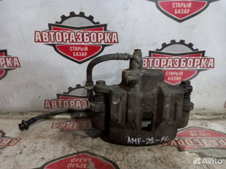 Суппорт тормозной передний левый Nissan Atlas